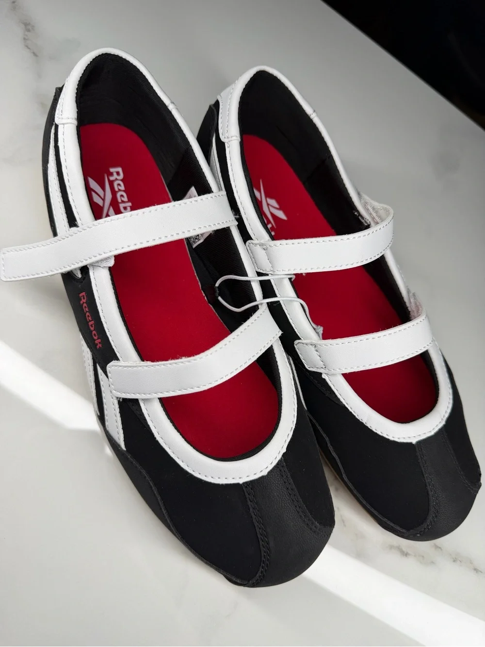 Reebok White and Black Mary-Jane Sneakers with Red Insole Accents